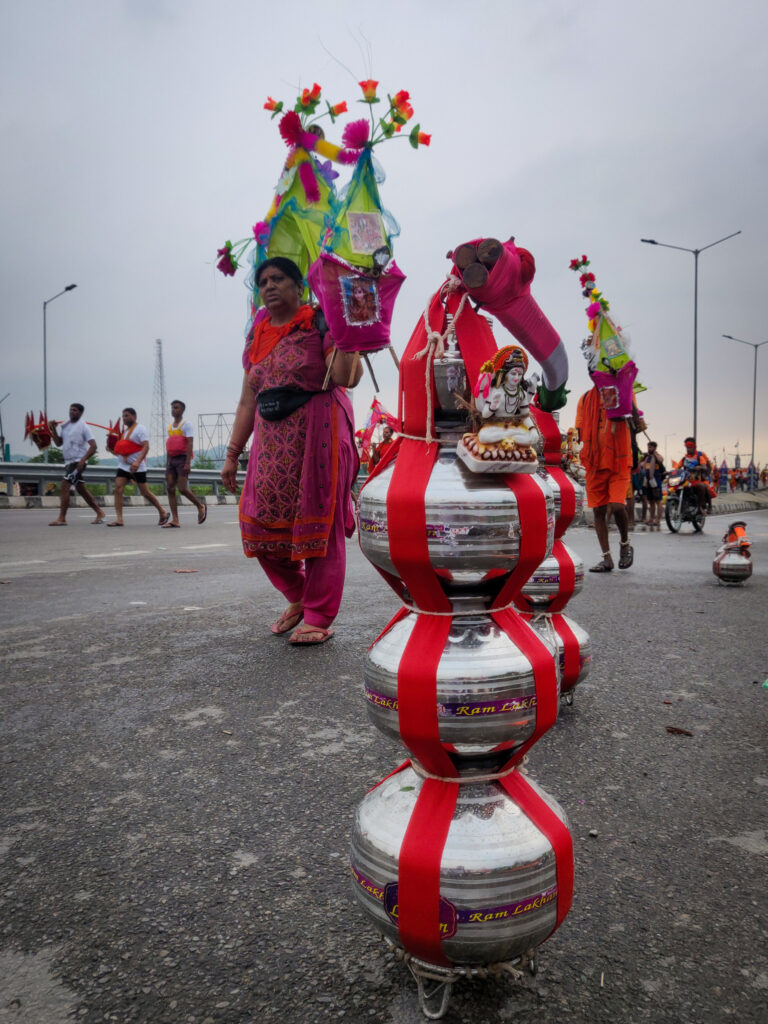 A woman carrying kanwar